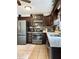 Modern kitchen featuring stainless steel appliances, granite countertops, and dark wood cabinets for a sleek look at 21 Picketts Ridge Ln, Acworth, GA 30101