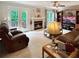 Cozy living room with a fireplace, plush sofas, and natural light is perfect for relaxation at 21 Picketts Ridge Ln, Acworth, GA 30101