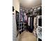 Organized walk-in closet with shelving and hanging rods, providing ample storage space at 21 Picketts Ridge Ln, Acworth, GA 30101