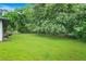Spacious backyard with lush green grass and mature trees at 3839 Brookcrest Cir, Decatur, GA 30032