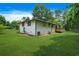 Wide backyard with an expansive green lawn and access to a wooden deck at 3839 Brookcrest Cir, Decatur, GA 30032