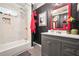 Updated bathroom featuring decorative tiling and a modern vanity at 3839 Brookcrest Cir, Decatur, GA 30032
