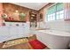 Bright bathroom featuring a freestanding tub, double sink vanity and wood floors at 3839 Brookcrest Cir, Decatur, GA 30032
