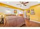 Bright bedroom with hardwood floors, a ceiling fan, and natural lighting from the windows at 3839 Brookcrest Cir, Decatur, GA 30032