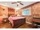Bedroom with decorative wallpaper, wood floors, and natural light at 3839 Brookcrest Cir, Decatur, GA 30032