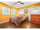 Spacious bedroom with wood floors, and bright yellow walls at 3839 Brookcrest Cir, Decatur, GA 30032