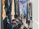 Walk-in closet features ample storage and organization with clothing racks and shelves at 3839 Brookcrest Cir, Decatur, GA 30032