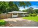 Shot of the front of the house with a concrete driveway and manicured lawn showcasing the charming exterior at 3839 Brookcrest Cir, Decatur, GA 30032