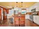 Bright kitchen featuring modern appliances, white cabinetry, and wood floors at 3839 Brookcrest Cir, Decatur, GA 30032