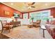 Inviting living room featuring classic furnishings, a ceiling fan, and warm, colorful walls that create a cozy atmosphere at 3839 Brookcrest Cir, Decatur, GA 30032