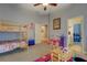 bedroom with bunkbeds, playroom, with view into a bathroom and bedroom at 410 Fitzgerald Ln, Fayetteville, GA 30215