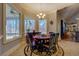 Cozy breakfast nook with a table, chairs, and windows overlooking the greenery of the outdoors at 410 Fitzgerald Ln, Fayetteville, GA 30215