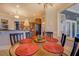 Breakfast area open to the kitchen featuring a round table with seating and natural light at 410 Fitzgerald Ln, Fayetteville, GA 30215