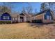Beautiful home with brick and blue siding, white trim, and a well-maintained lawn at 410 Fitzgerald Ln, Fayetteville, GA 30215
