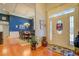 Bright foyer with hardwood floors, transom window, and view into dining area with blue accent wall at 410 Fitzgerald Ln, Fayetteville, GA 30215