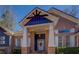 Close-up of a charming home's entrance, showcasing brick accents, white columns, and a welcoming door at 410 Fitzgerald Ln, Fayetteville, GA 30215