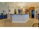 Spacious kitchen with an island, stainless steel appliances, light blue walls and tile flooring at 410 Fitzgerald Ln, Fayetteville, GA 30215