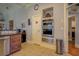 Kitchen featuring stainless steel appliances, a coffee bar, and tile flooring with ample natural light at 410 Fitzgerald Ln, Fayetteville, GA 30215