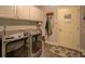Laundry room featuring a full size washer and dryer with gray tile flooring at 410 Fitzgerald Ln, Fayetteville, GA 30215