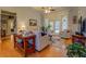 Open living room featuring hardwood floors, french doors to the backyard, and neutral decor at 410 Fitzgerald Ln, Fayetteville, GA 30215