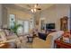 Bright living room featuring coffered ceilings, hardwood floors, and a comfortable seating area at 410 Fitzgerald Ln, Fayetteville, GA 30215