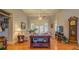 Spacious living room with coffered ceiling, neutral paint, hardwood floors, and view to the backyard at 410 Fitzgerald Ln, Fayetteville, GA 30215