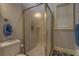 Corner shower stall enclosed with frosted glass door and chrome trim at 410 Fitzgerald Ln, Fayetteville, GA 30215