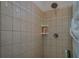Shower space in main bathroom featuring tiled walls and shower head at 410 Fitzgerald Ln, Fayetteville, GA 30215