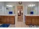 and vanities with mirrors and lighting at 410 Fitzgerald Ln, Fayetteville, GA 30215