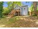 Exterior view showcasing a wooden deck with stairs leading to the expansive backyard at 782 Marion Se Ave, Atlanta, GA 30312