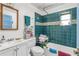 Cozy bathroom featuring blue tiled walls and a bathtub at 782 Marion Se Ave, Atlanta, GA 30312