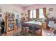 Cozy bedroom with hardwood floors, leaded glass windows and vintage decor at 782 Marion Se Ave, Atlanta, GA 30312