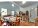 Bright dining room with a large table, chairs, and natural light from multiple windows at 782 Marion Se Ave, Atlanta, GA 30312