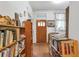 Welcoming entryway featuring hardwood floors, charming bookshelves, and a decorative stained glass window at 782 Marion Se Ave, Atlanta, GA 30312