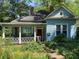 Charming blue home with a cozy front porch and a lovely landscaped yard at 782 Marion Se Ave, Atlanta, GA 30312
