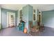 Covered front porch with traditional rocking chairs and storage space at 782 Marion Se Ave, Atlanta, GA 30312