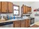 Well-lit kitchen with stainless steel appliances and wooden cabinets at 782 Marion Se Ave, Atlanta, GA 30312