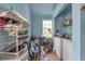 Blue toned Laundry room featuring, washer, dryer, window, and storage at 782 Marion Se Ave, Atlanta, GA 30312