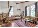 Bright living room with high ceilings, large windows, wood floors, and comfortable seating at 782 Marion Se Ave, Atlanta, GA 30312