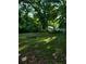 Large, grassy backyard featuring shade trees at 1167 Oakland Sw Dr, Atlanta, GA 30310