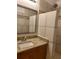 Bathroom features tan tiling, a walk-in shower, and granite countertops at 1167 Oakland Sw Dr, Atlanta, GA 30310