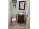 Charming powder room showcasing a vessel sink, marble countertop, and decorative fixtures at 1167 Oakland Sw Dr, Atlanta, GA 30310