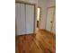 Bedroom features a closet with white doors, and hardwood floors with trim at 1167 Oakland Sw Dr, Atlanta, GA 30310