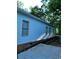 The exterior of this home features vinyl siding and manicured landscaping at 1167 Oakland Sw Dr, Atlanta, GA 30310