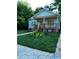 Charming single-story home with a welcoming front porch and meticulously landscaped front yard at 1167 Oakland Sw Dr, Atlanta, GA 30310