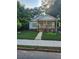 Charming one-story home featuring a welcoming front porch and lush green lawn at 1167 Oakland Sw Dr, Atlanta, GA 30310
