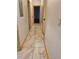 Hallway featuring modern tile floors and natural wood trim for a warm and inviting atmosphere at 1167 Oakland Sw Dr, Atlanta, GA 30310