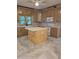 Newly renovated kitchen with island, white cabinets, and modern appliances at 1167 Oakland Sw Dr, Atlanta, GA 30310