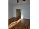 Spacious living room with hardwood floors and natural wood trim throughout the house at 1167 Oakland Sw Dr, Atlanta, GA 30310