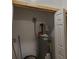 Utility closet with water heater and essential plumbing, neatly organized for efficient space use at 1167 Oakland Sw Dr, Atlanta, GA 30310
